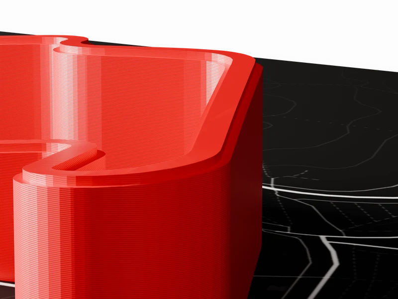 Close-up of the side wall of the printed track showing fine horizontal layer lines.